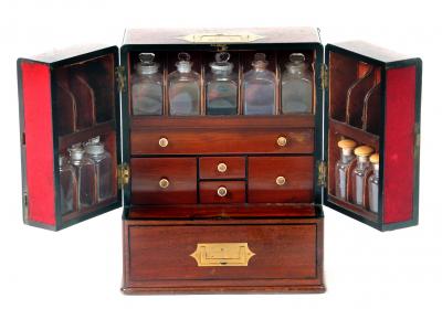 Appraisal: A MAHOGANY TRAVELLING APOTHECARY CHEST early th century of rounded