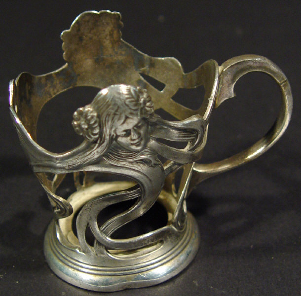 Appraisal: WMF Art Nouveau silver plated glass holder cast in relief