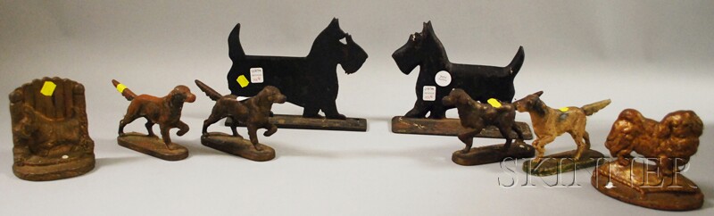 Appraisal: Four Cast Iron Dog Figural Doorstops a Bookend a Doorstop