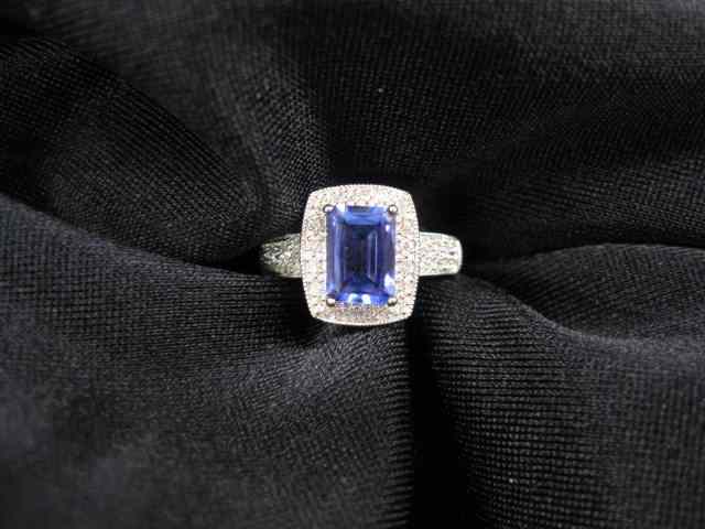 Appraisal: Tanzanite Diamond Ring carat emerald cut gem surrounded by diamonds