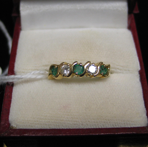 Appraisal: EMERALD DIAMOND AND FOURTEEN KARAT GOLD RING set with three