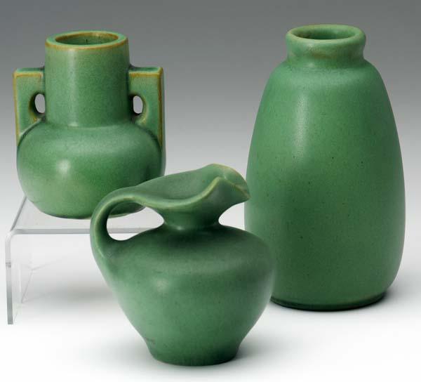 Appraisal: TECO Three vases covered in matte green glaze Nick near