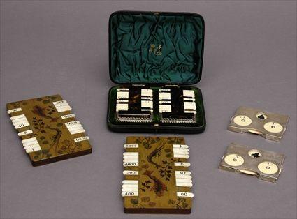 Appraisal: TWO PAIRS OF SILVER-MOUNTED GAMING COUNTERS AND A PAIR OF