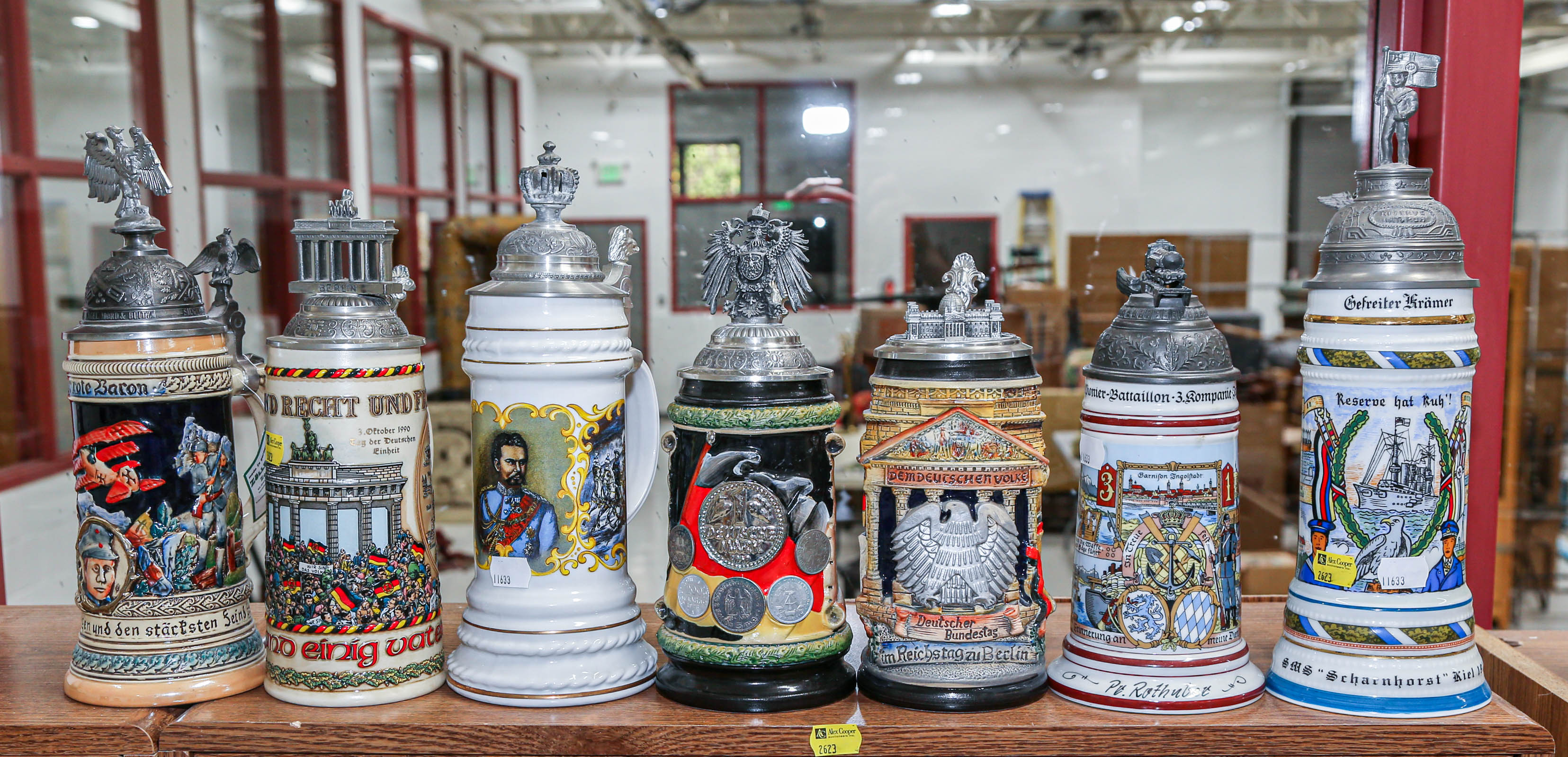 Appraisal: SEVEN GERMAN STEINS Including reproduction regimental steins other pertaining to