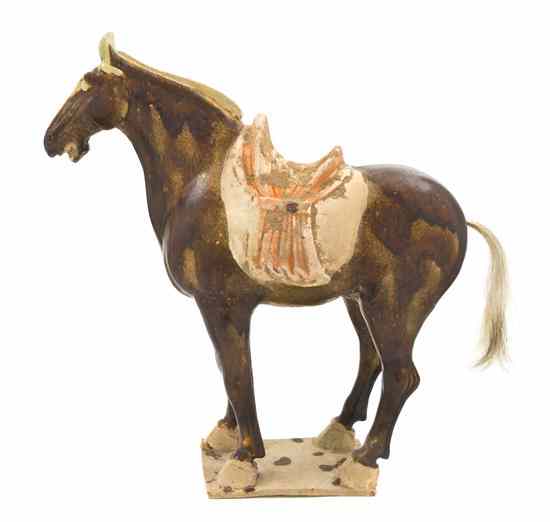 Appraisal: A Tang Dynasty Pottery Horse depicted in a standing pose