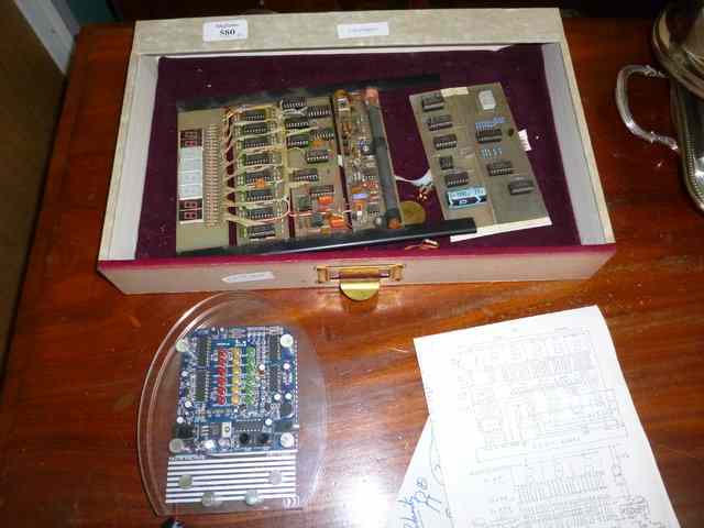 Appraisal: AN ATOMIC CLOCK with circuit board together with a Daka