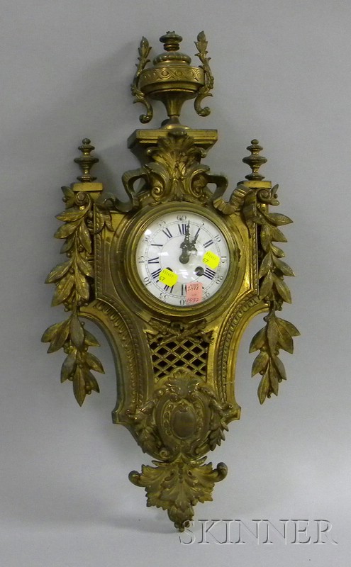 Appraisal: French Brass Cartel Wall Clock with enameled Roman numeral dial