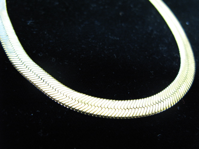 Appraisal: FOURTEEN KARAT GOLD CHAIN NECKLACE - inch herringbone chain Weight