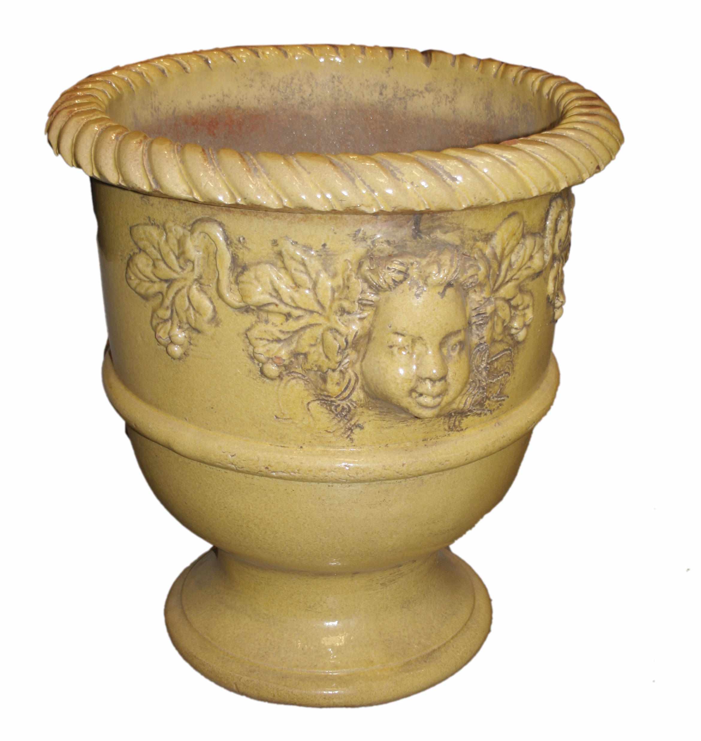 Appraisal: A pair of Italian Renaissance style glazed terracotta urns height