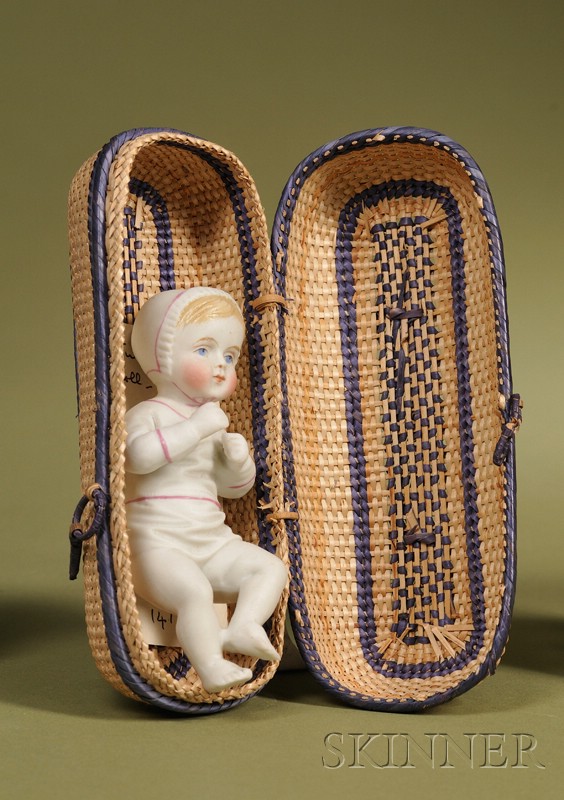 Appraisal: All Bisque Baby in a Basket Germany c untinted bisque