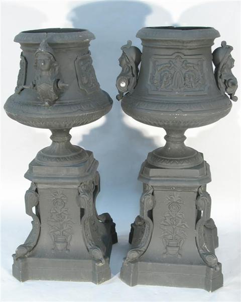 Appraisal: PAIR OF REGENCY STYLE BLACK PAINTED GARDEN URNS The urns