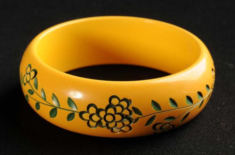 Appraisal: Bakelite Carved Yellow Bracelet with Floral Design Condition Excellent Size