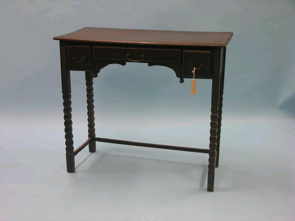 Appraisal: A Victorian oak writing table shallow rectangular form with three