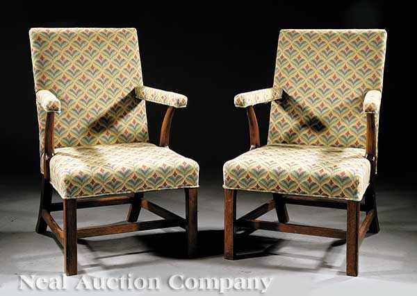 Appraisal: A Pair of George III-Style Mahogany Gainsborough Armchairs with straight