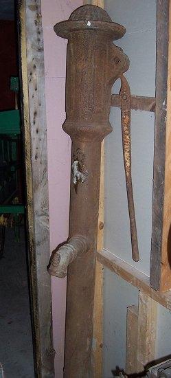 Appraisal: A cast iron pump by W Hedges complete with handle