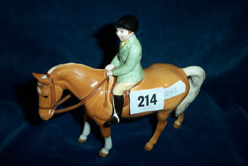 Appraisal: A Beswick model of a young boy in green hunting