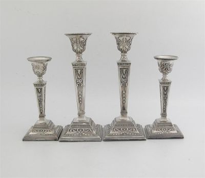 Appraisal: Two matching graduated pairs of modern candlesticks Neo Classical style