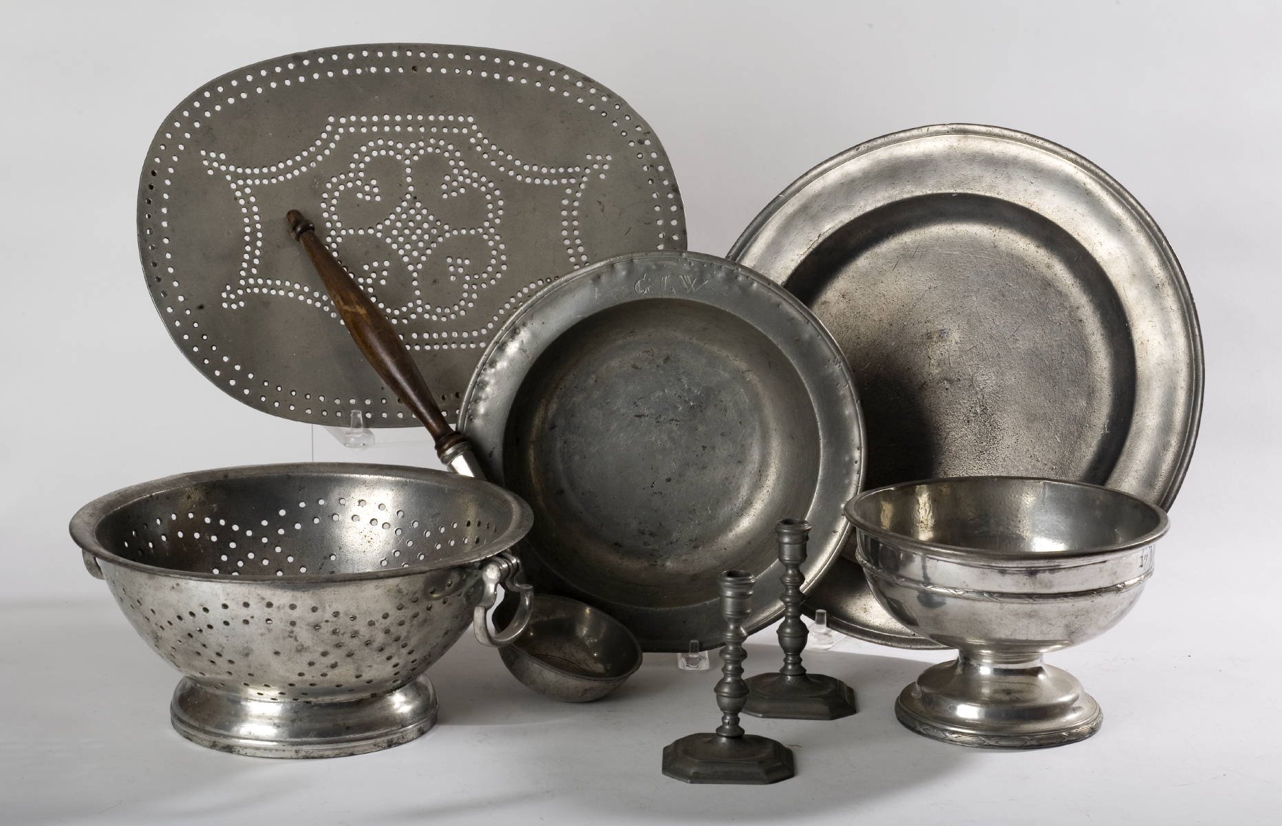 Appraisal: COLLECTION OF PEWTER TABLE OBJECTS INCLUDING A COLLANDER AN OVAL