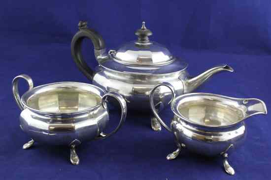 Appraisal: A George V panelled silver three piece tea set of