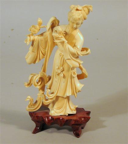 Appraisal: Chinese elephant ivory figure Female beauty with ribbon scrolls wood