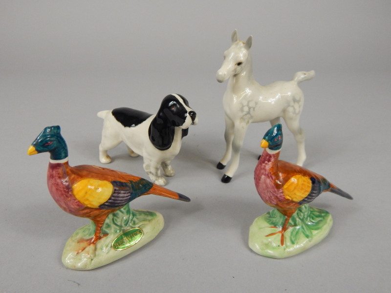 Appraisal: Four Beswick items a Dappled Grey foal a black and