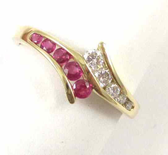 Appraisal: RUBY DIAMOND AND FOURTEEN KARAT GOLD RING with five round-cut