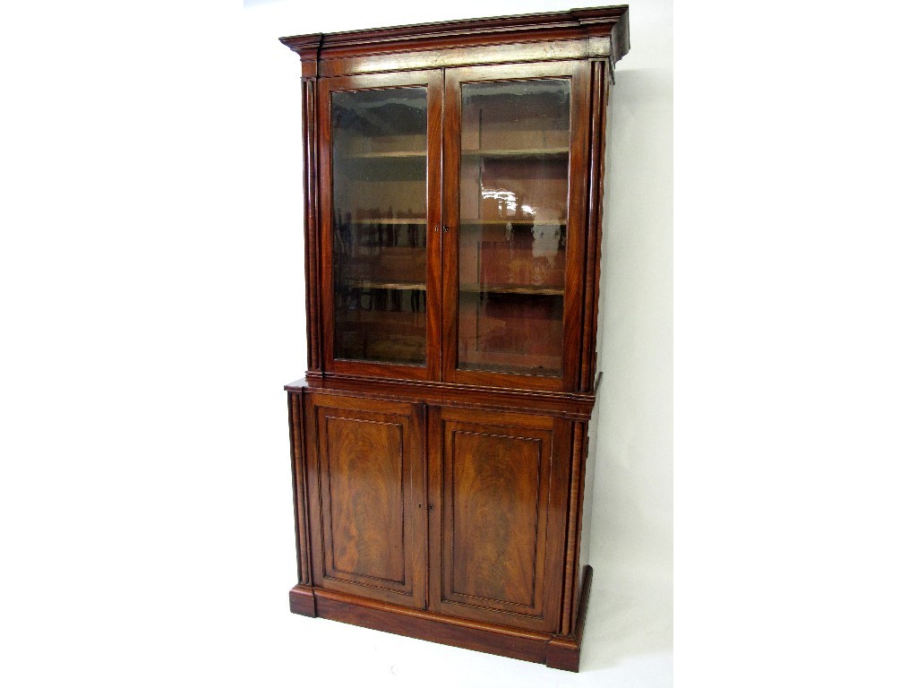 Appraisal: A Victorian mahogany bookcase on a chiffonier base the moulded