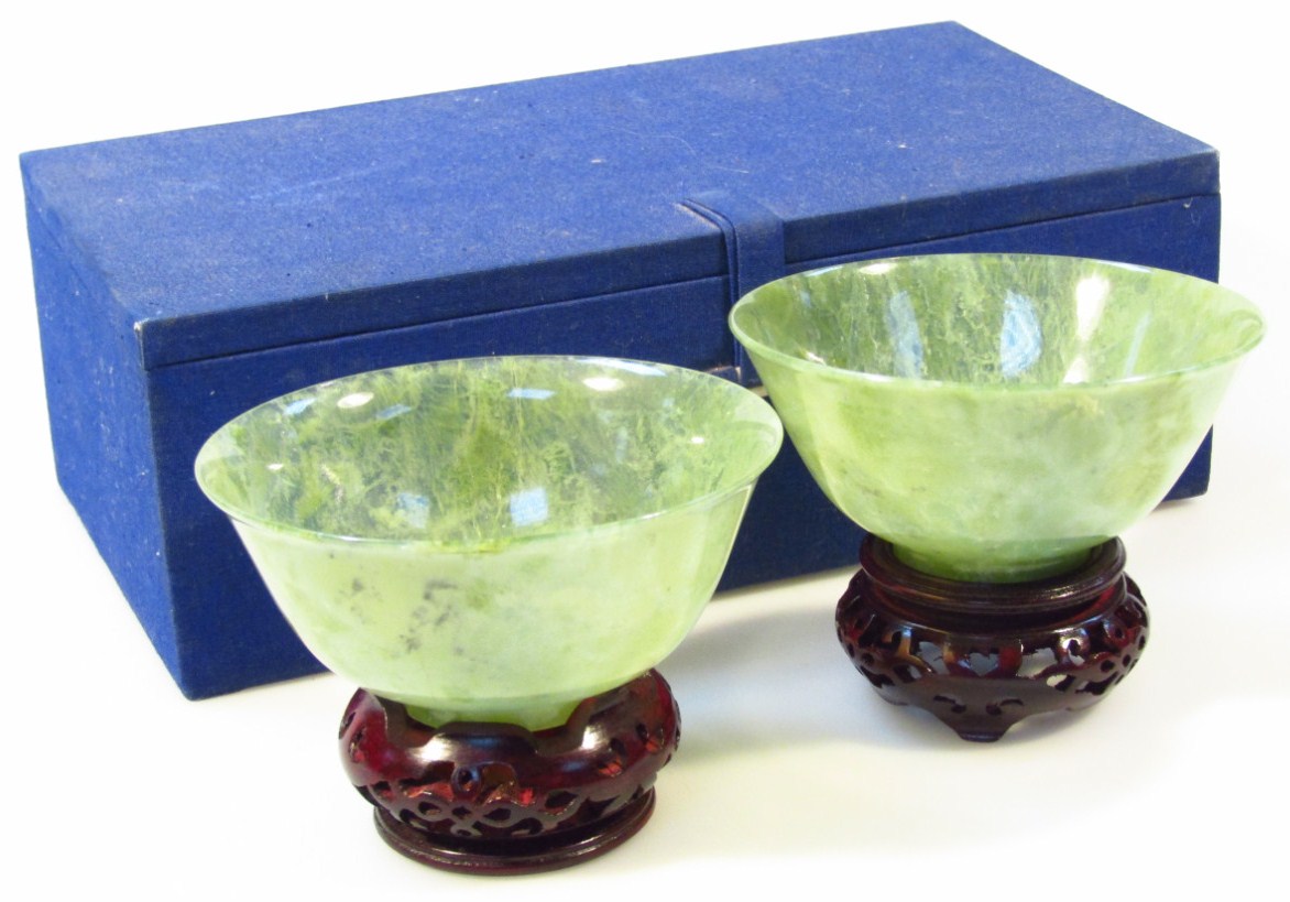 Appraisal: A pair of late Qing period Chinese polished green jade