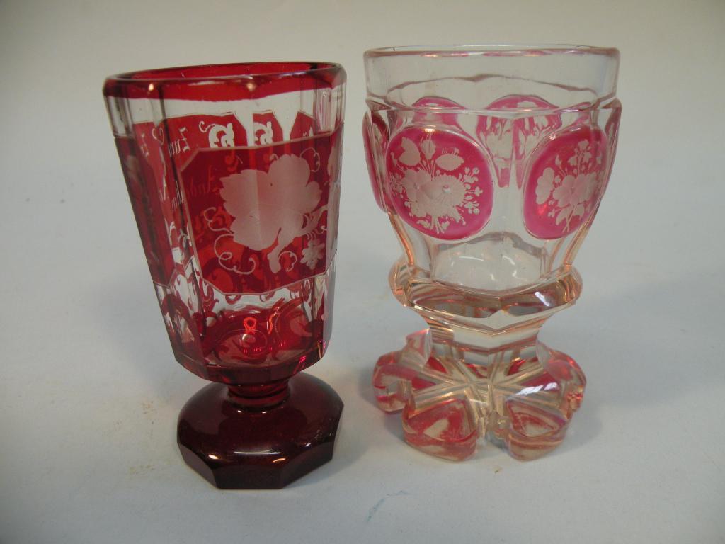 Appraisal: A Bohemian ruby flash goblet engraved with flowers and another