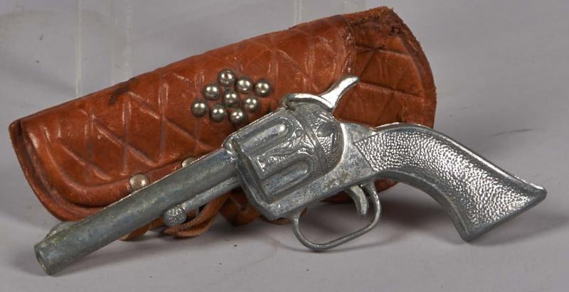 Appraisal: Small Toy Revolver In Leather Fringed Holster Holster has silver