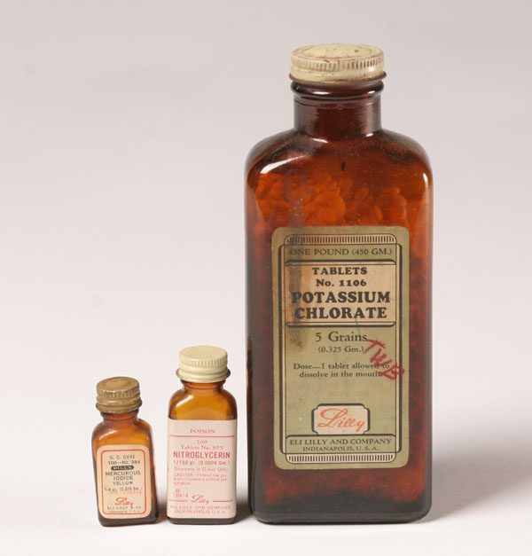 Appraisal: Approximately Lilly medicine bottles metal and plastic screw cap Tallest