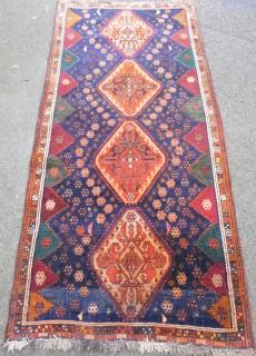 Appraisal: Persian blue ground rug with four lozenge shaped medallions cm