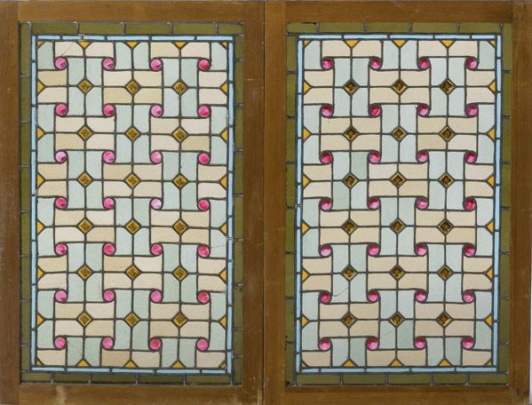 Appraisal: STAINED GLASS WINDOWS Pair with interwoven design with jeweled accents