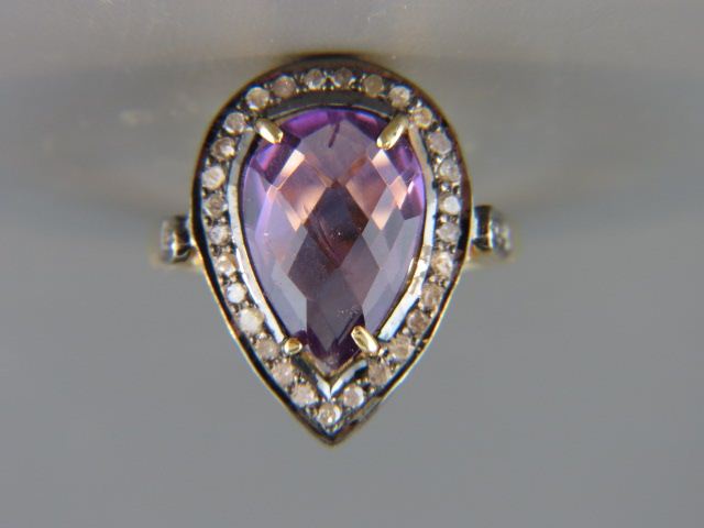 Appraisal: Diamond Amethyst Ring vivid pear shape carat gem surrounded by