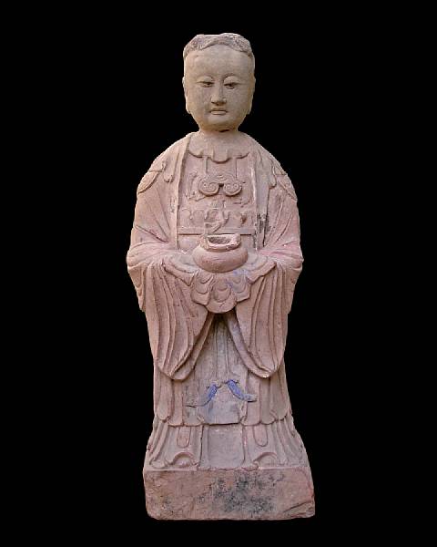 Appraisal: A Chinese carved red sandstone figure of a female attendant