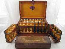 Appraisal: An early th century oak games box with chess set