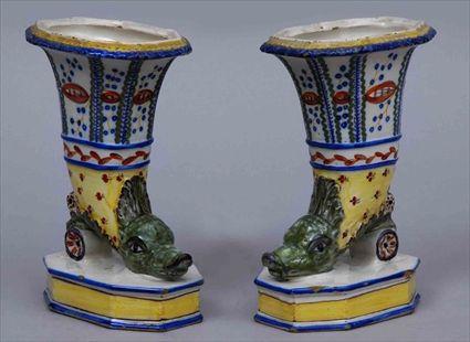 Appraisal: PAIR OF POLYCHROME FAIENCE CORNUCOPIA VASES Each horn-shape holder rising