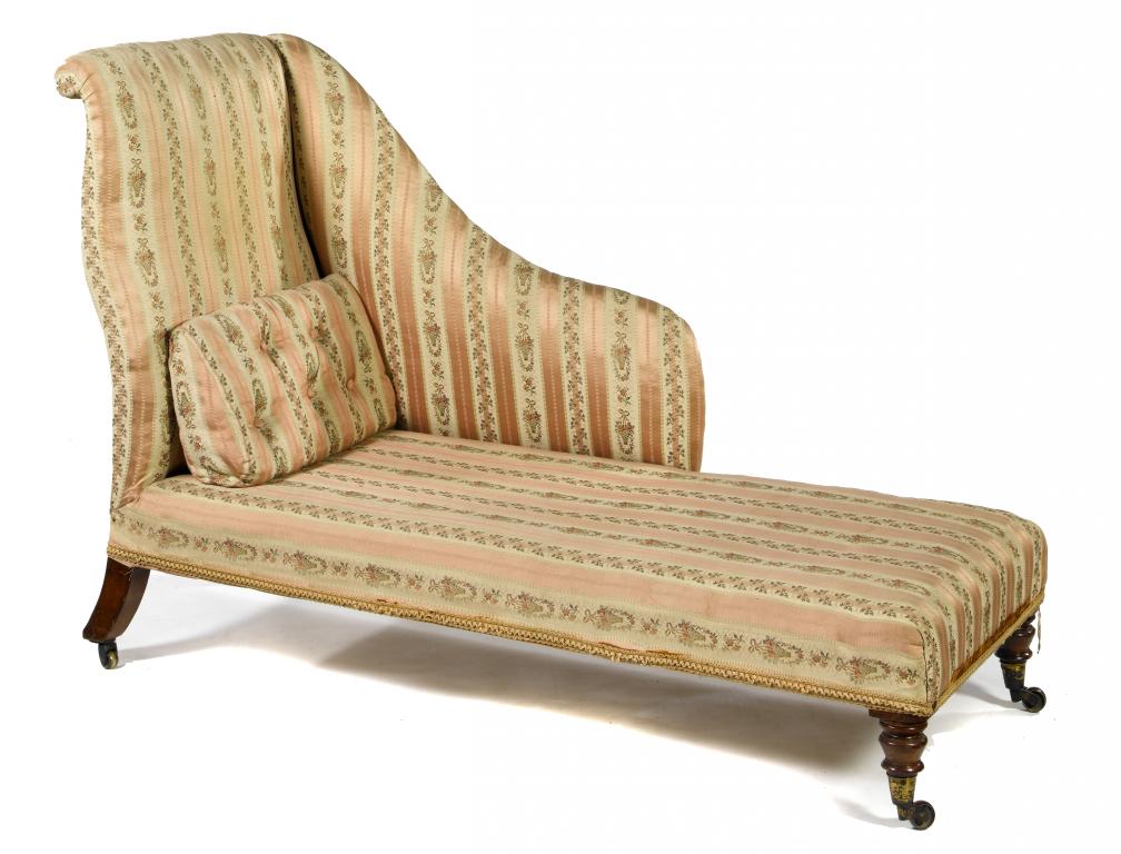 Appraisal: A VICTORIAN WALNUT CHAISE LONGUE with scroll back and shaped