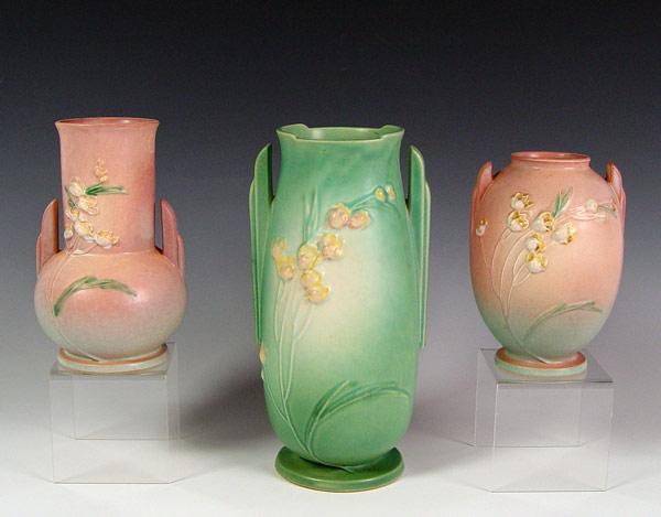 Appraisal: THREE ROSEVILLE POTTERY IXIA VASES Green and pink - ''