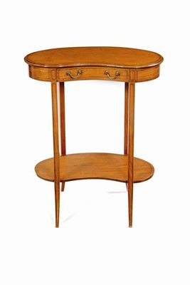 Appraisal: A late Victorian satinwood kidney shaped side table the top