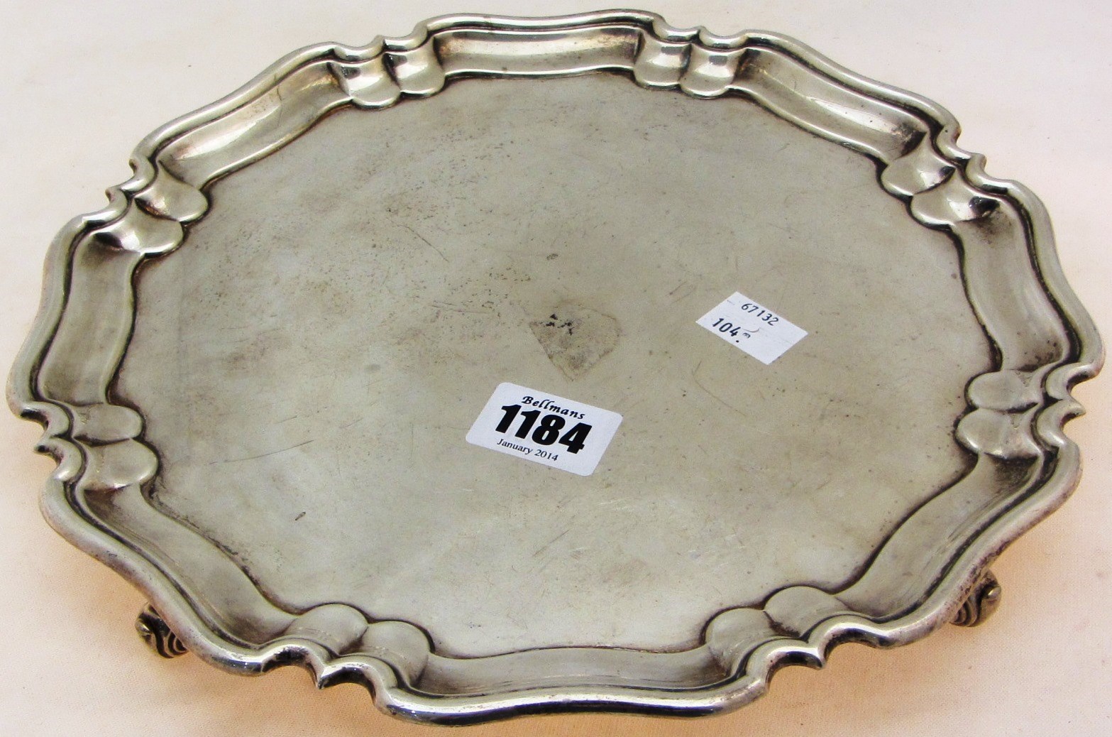 Appraisal: A silver salver of shaped circular form with a piecrust