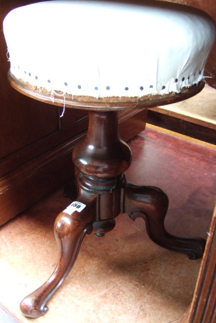 Appraisal: A Victorian rosewood framed piano stool the circular height adjustable