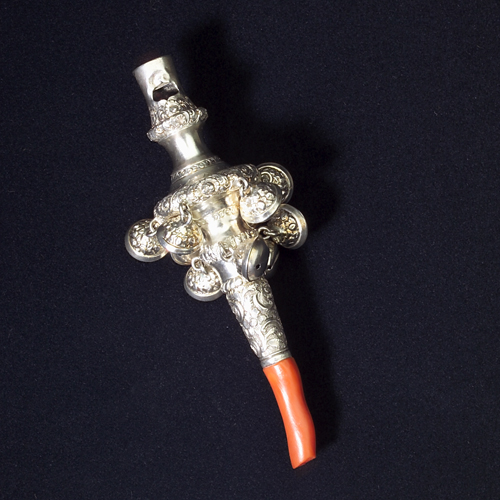 Appraisal: Sterling baby rattle with whistle and coral tether English silver