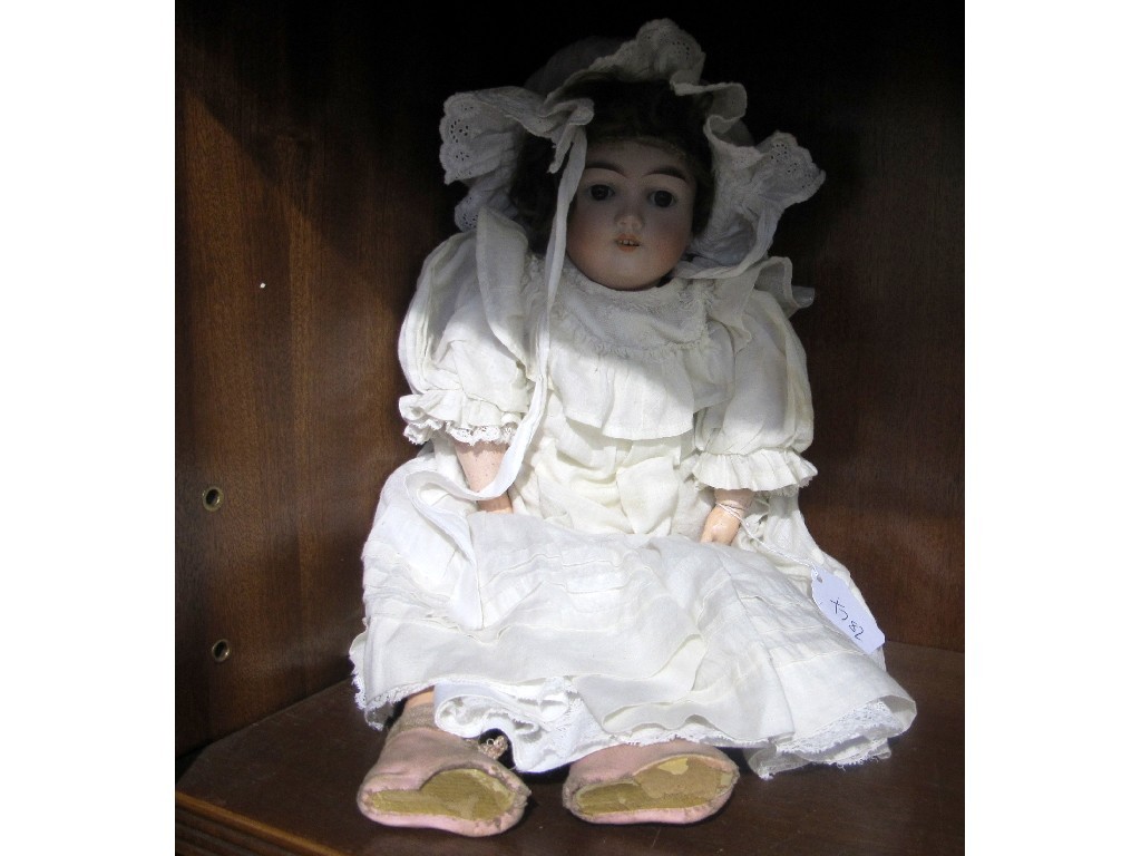 Appraisal: A bisque headed girl doll