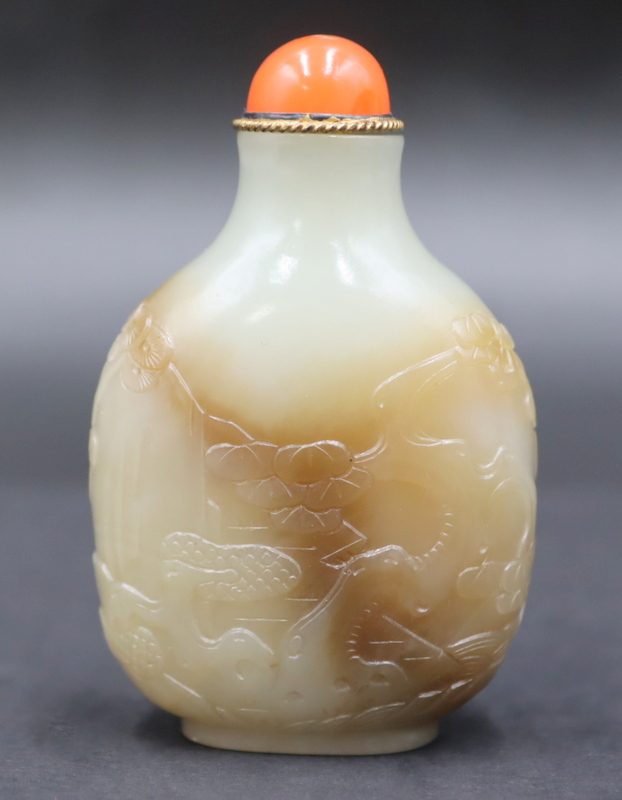 Appraisal: TH C CHINESE CELADON AND RUSSET JADE SNUFF Bottle th