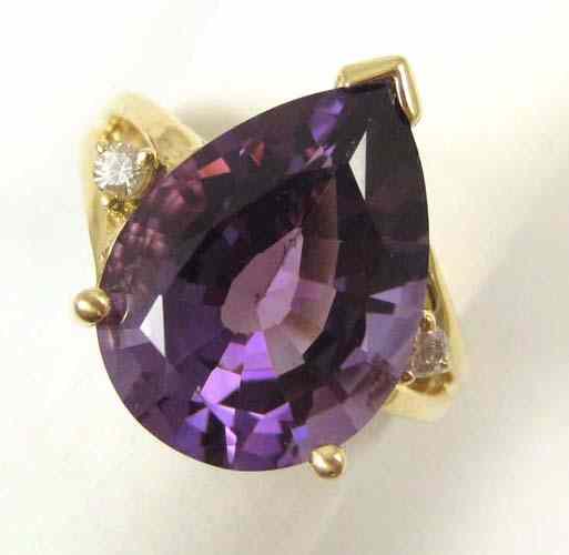 Appraisal: AMETHYST DIAMOND AND FOURTEEN KARAT GOLD RING set with a