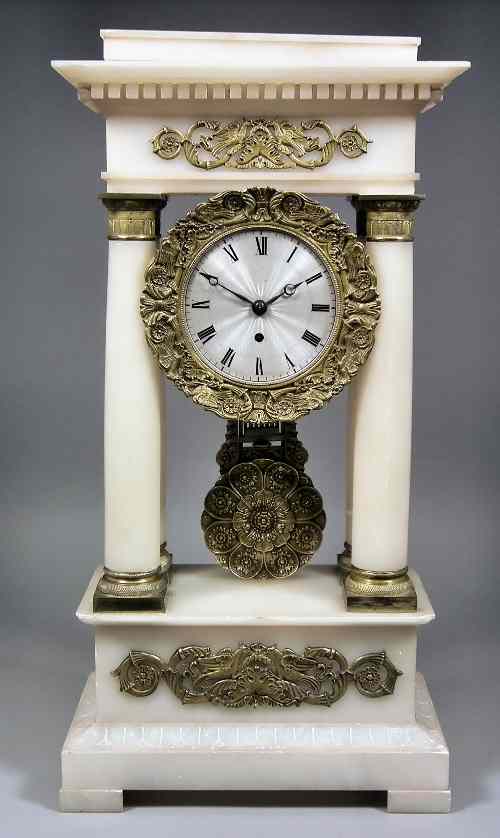 Appraisal: A th Century French alabaster and ormolu mounted portico timepiece