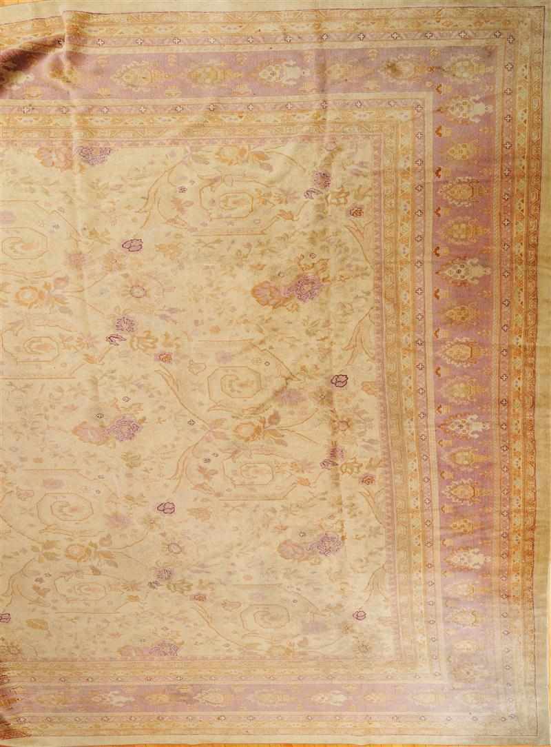 Appraisal: LARGE CREAM AND PINK GROUND AGRA CARPET With an all