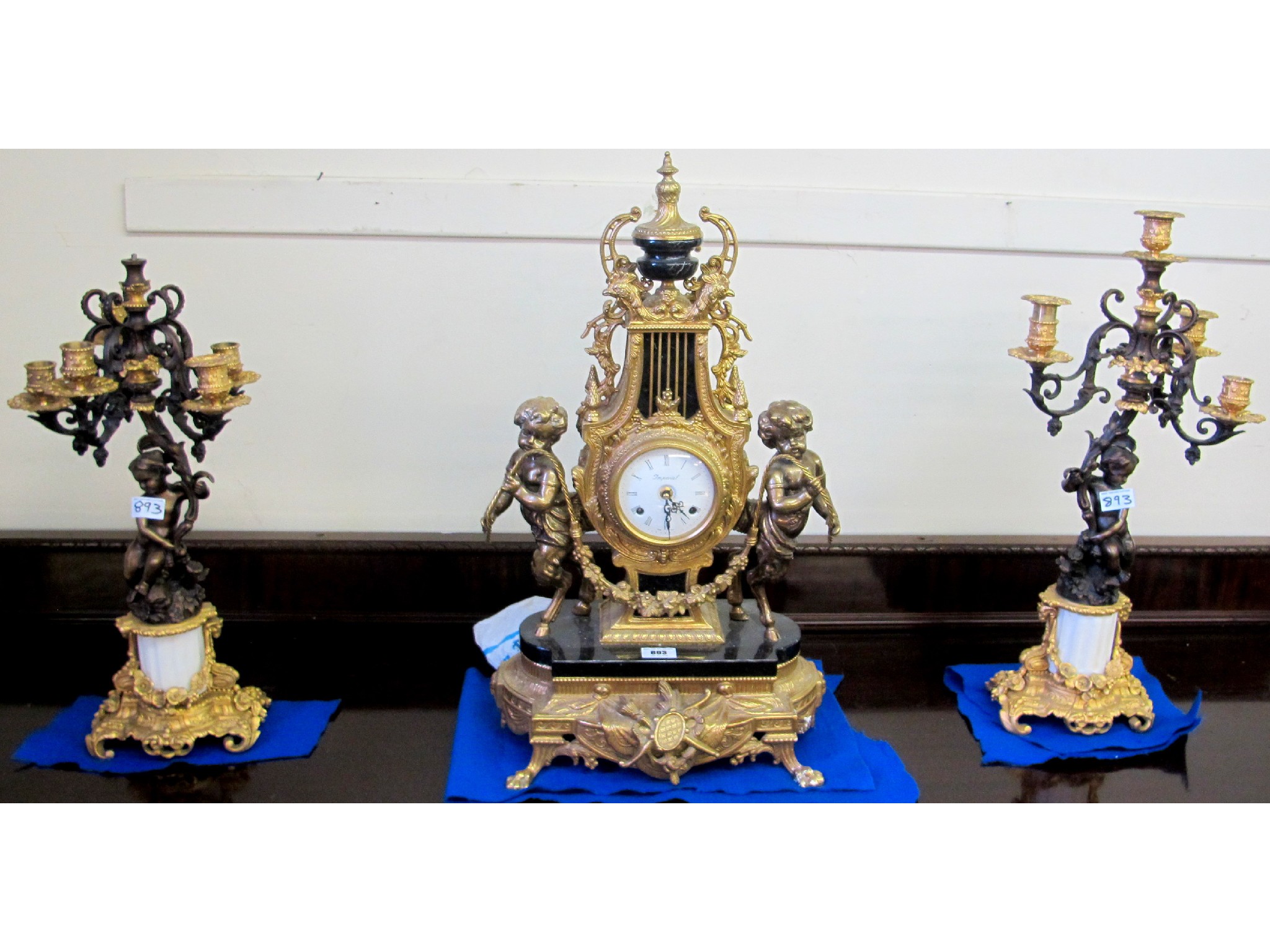 Appraisal: A Louis XV style gilt mantle clock with a pair