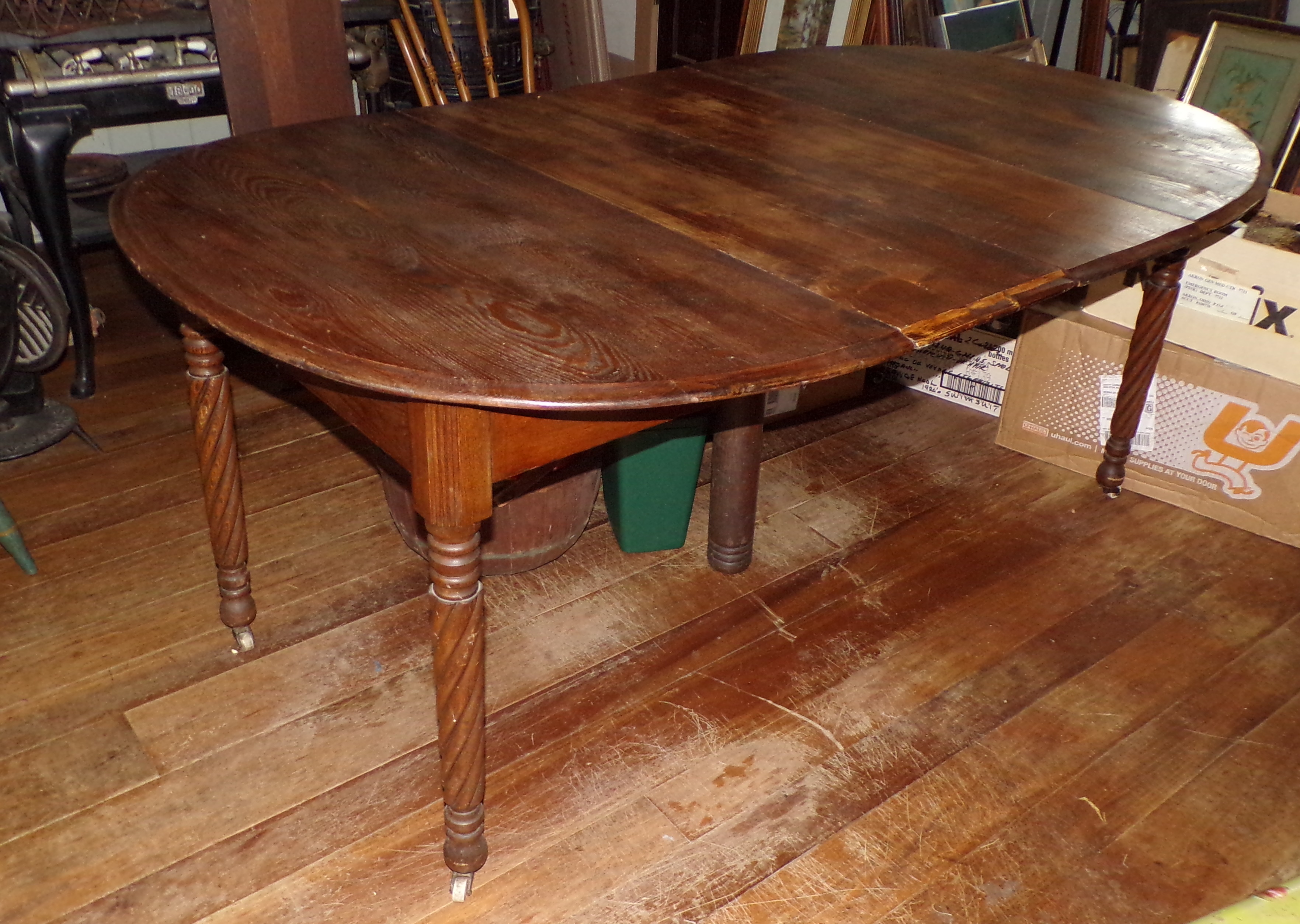 Appraisal: Chestnut kitchen table turned rope legs x x '' with